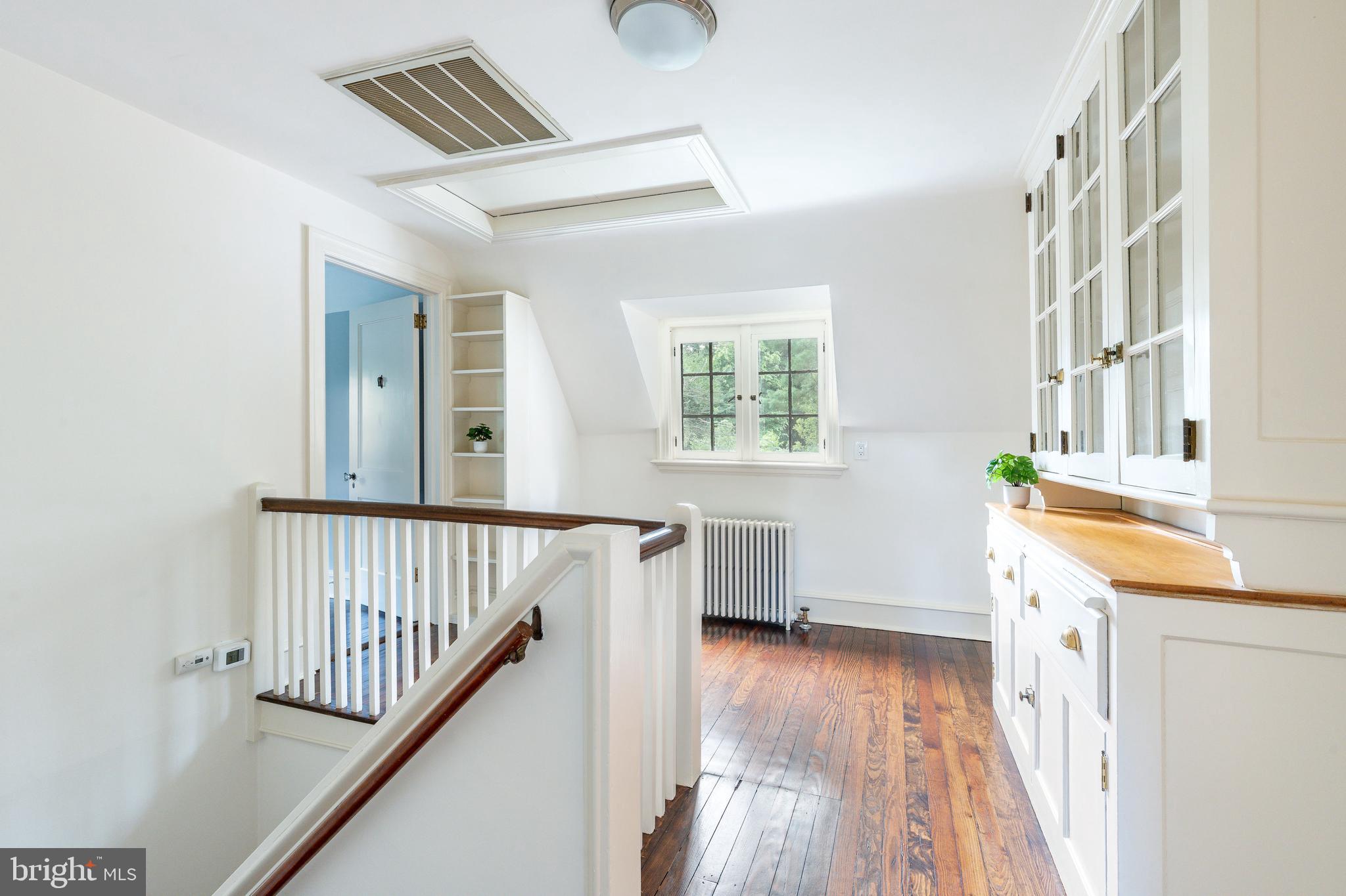 1419 County Line Road Bryn Mawr, PA 19010 - Photo 43 of 65 a view of a hallway with wooden floor and staircase