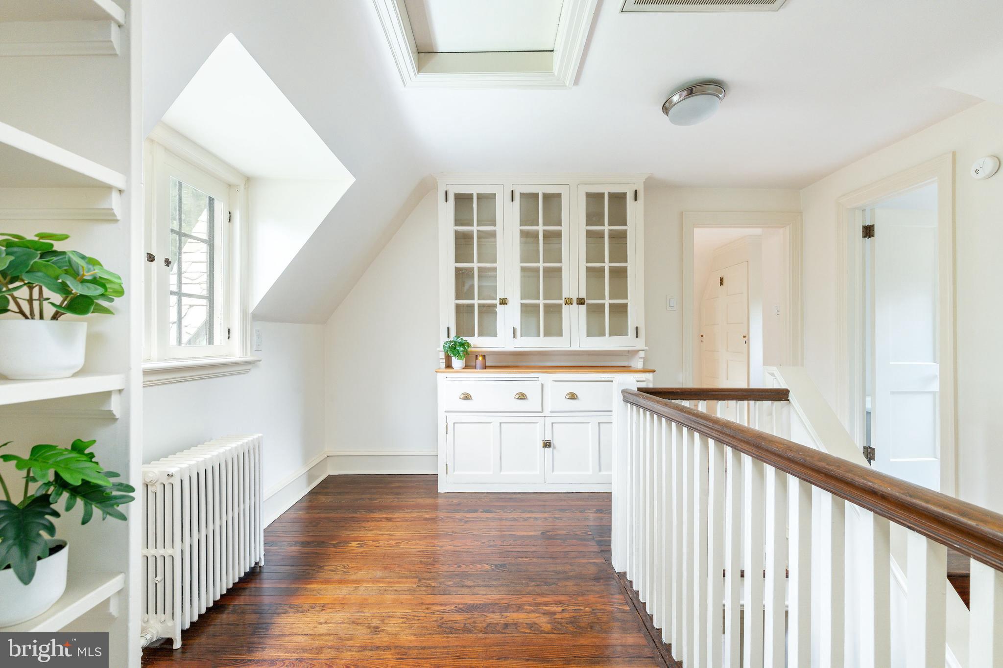 1419 County Line Road Bryn Mawr, PA 19010 - Photo 44 of 65 a view of a kitchen and an entryway with wooden floor