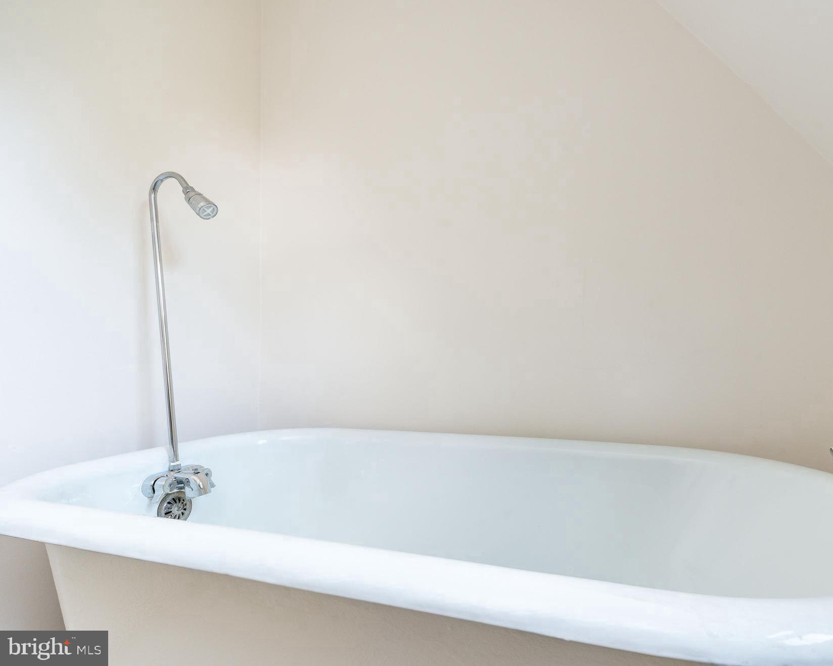 1419 County Line Road Bryn Mawr, PA 19010 - Photo 47 of 65 a bathroom with a bathtub and a sink