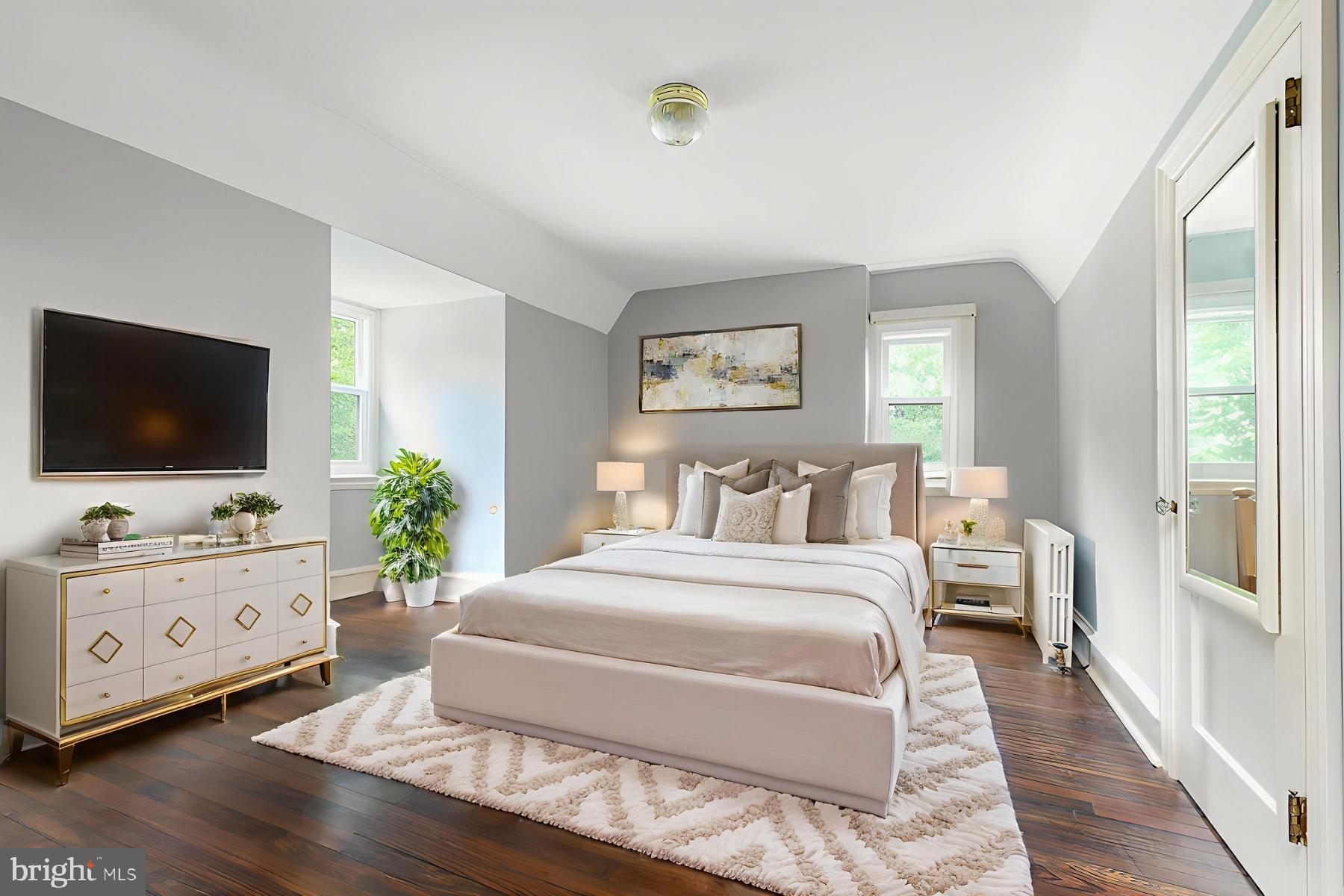 1419 County Line Road Bryn Mawr, PA 19010 - Photo 48 of 65 a bedroom with a bed and a flat screen tv