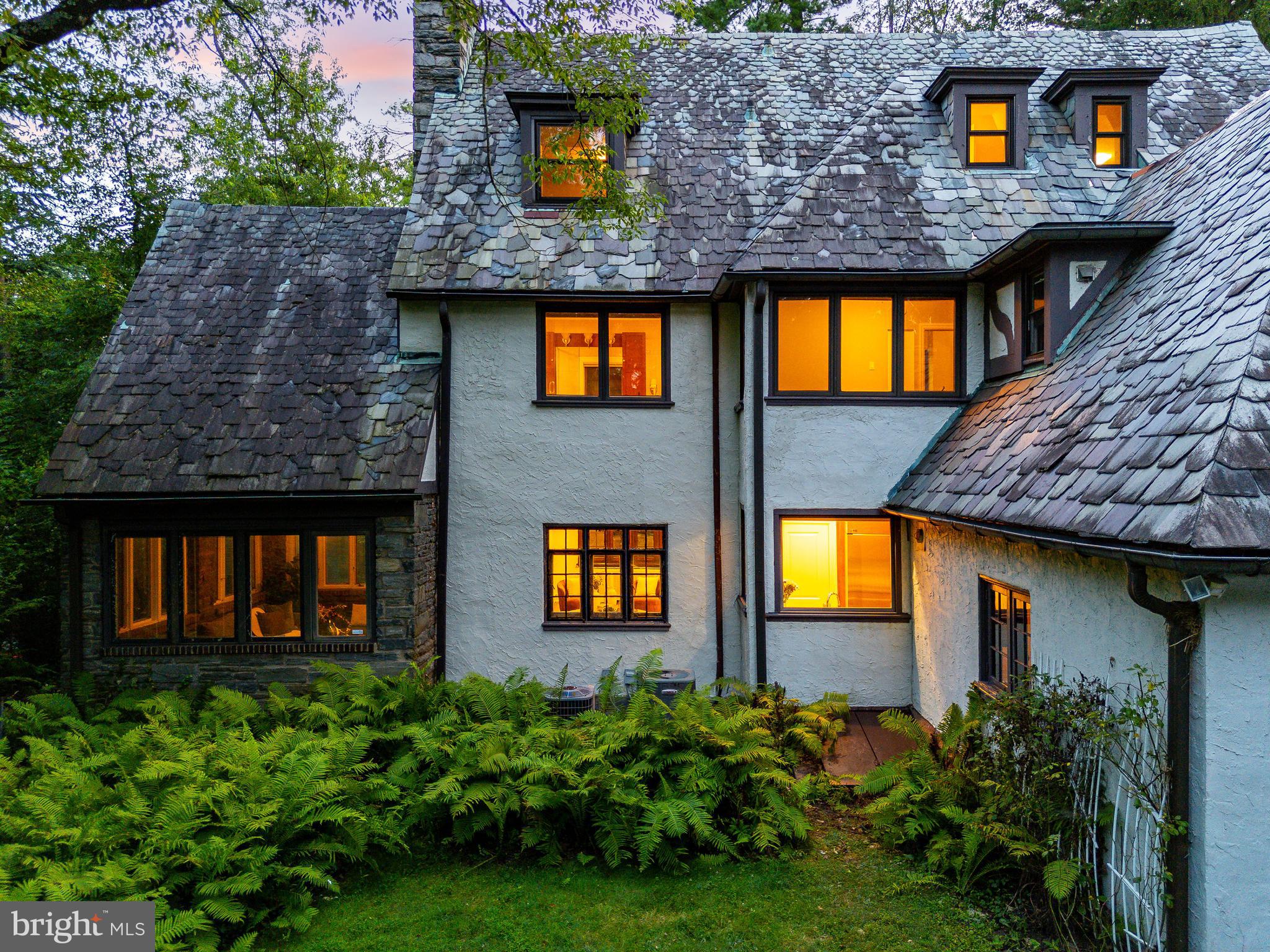 1419 County Line Road Bryn Mawr, PA 19010 - Photo 51 of 65 a view of a brick house next to a yard