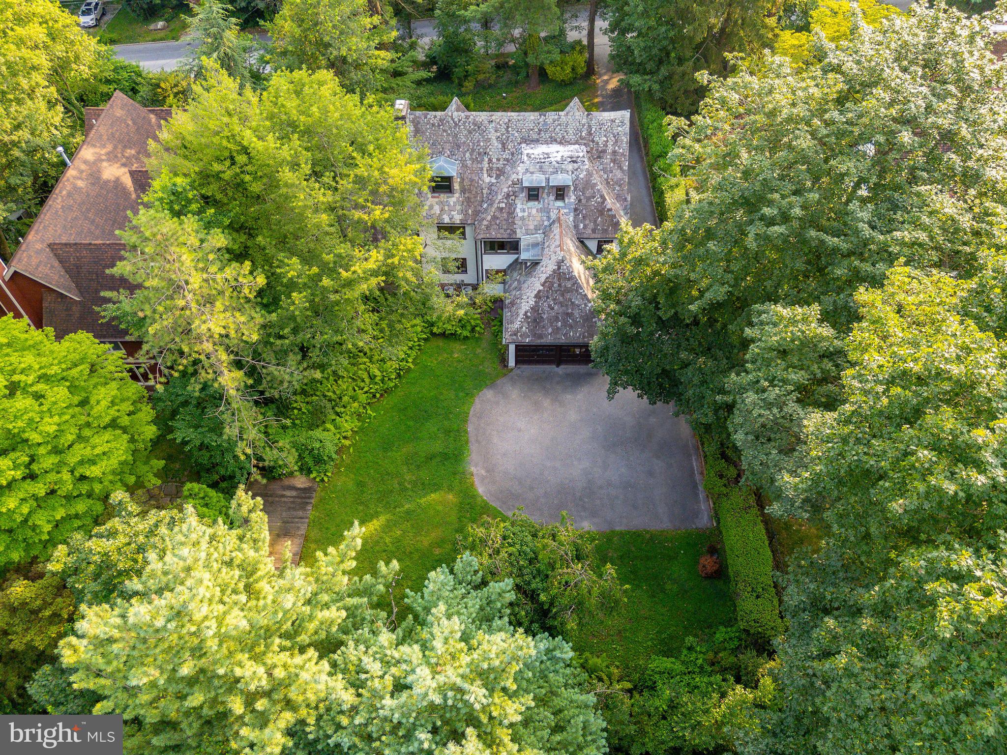 1419 County Line Road Bryn Mawr, PA 19010 - Photo 61 of 65 an aerial view of residential house with outdoor space and trees all around