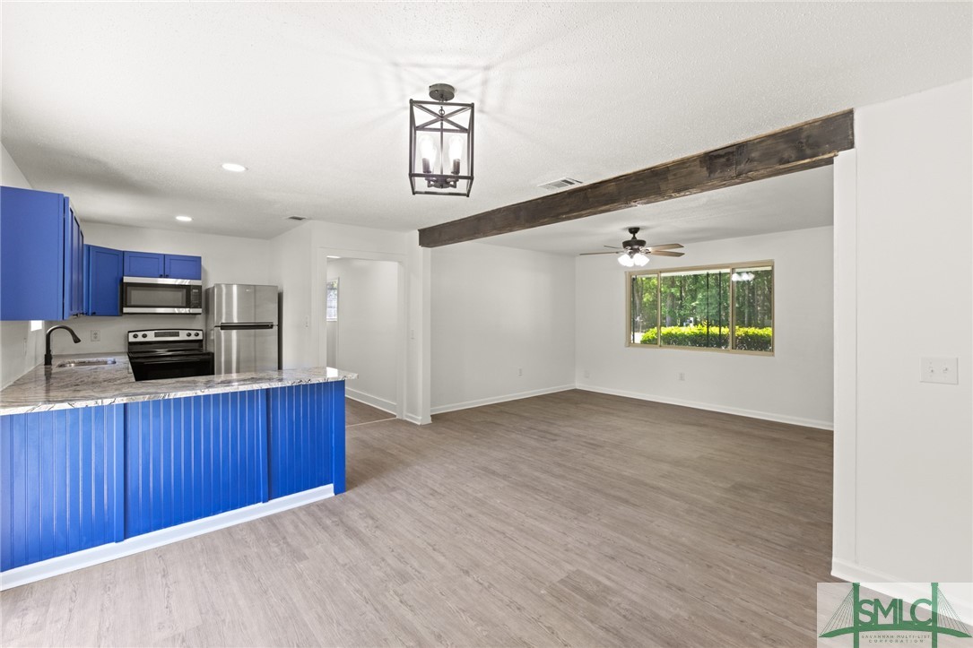 207 Tunnel Road Springfield, GA 31329 - Photo 10 of 19 Kitchen & Living Room