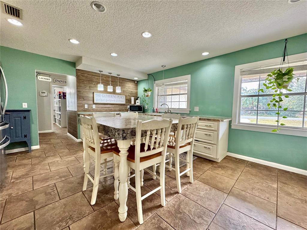 7625 East Misty Lane Inverness, FL 34450 - Photo 16 of 58 a kitchen with a table and chairs in it
