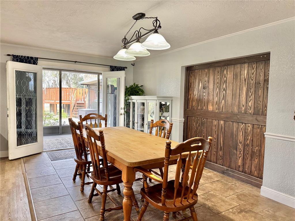 7625 East Misty Lane Inverness, FL 34450 - Photo 28 of 58 a view of a dining room with furniture window and outside view