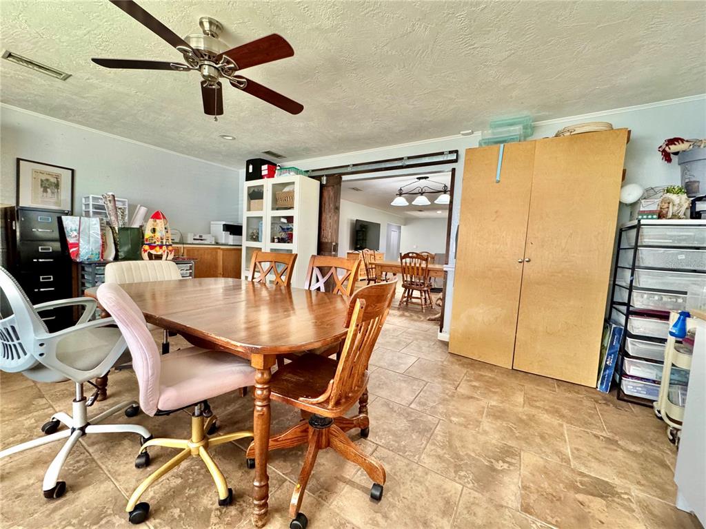 7625 East Misty Lane Inverness, FL 34450 - Photo 30 of 58 a dining room with furniture and wooden floor