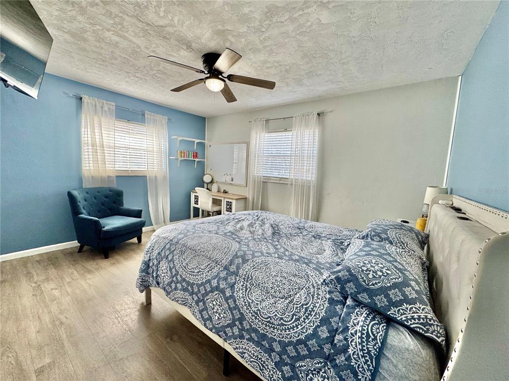 7625 East Misty Lane Inverness, FL 34450 - Photo 36 of 58 a bedroom with a bed gym equipment and a window