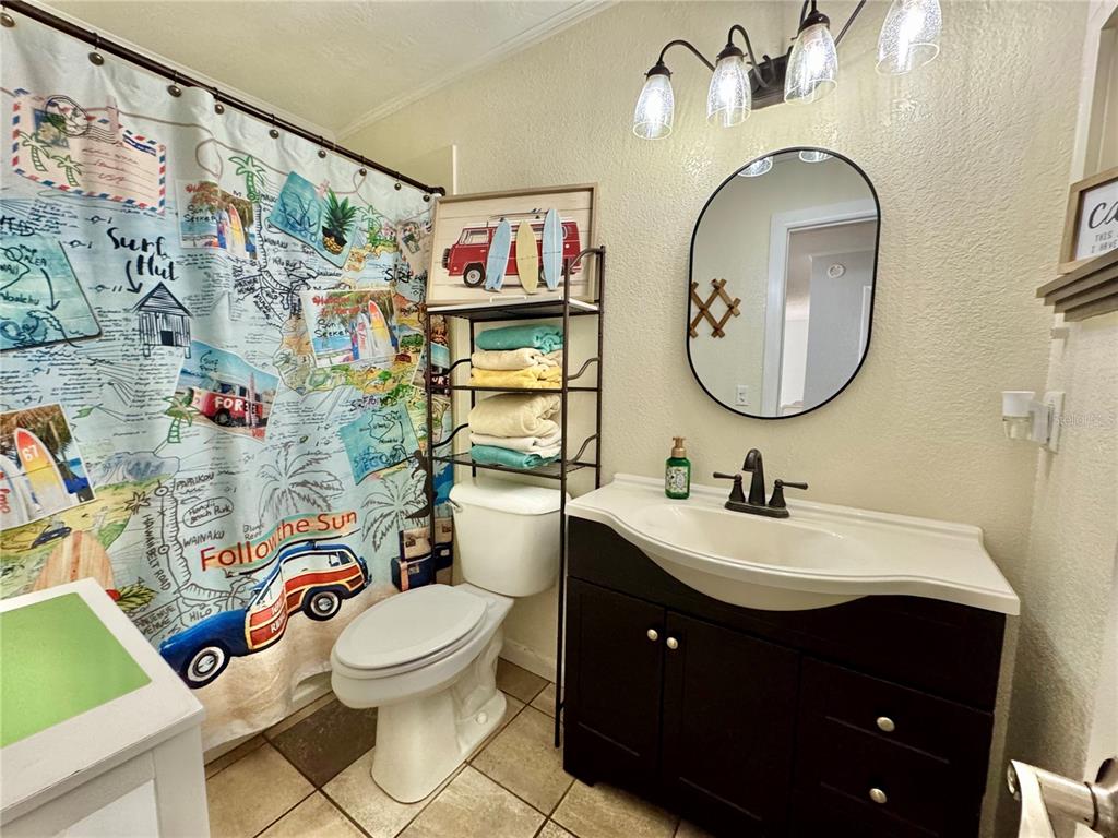 7625 East Misty Lane Inverness, FL 34450 - Photo 38 of 58 a bathroom with a toilet a sink and a mirror