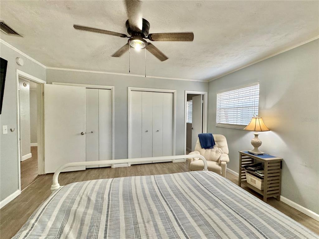 7625 East Misty Lane Inverness, FL 34450 - Photo 43 of 58 a view of a bedroom with wooden floor and furniture