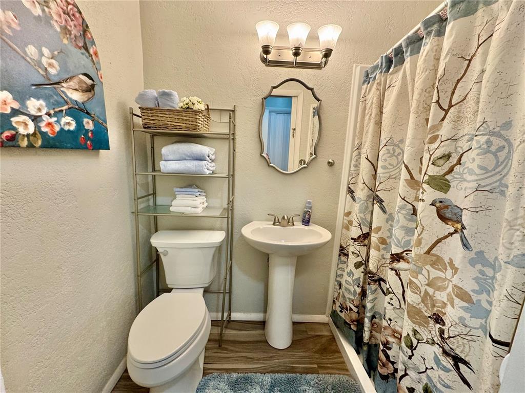 7625 East Misty Lane Inverness, FL 34450 - Photo 48 of 58 a white toilet sitting next to a bathroom sink