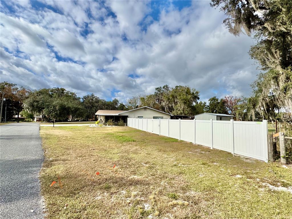 7625 East Misty Lane Inverness, FL 34450 - Photo 55 of 58 a view of a swimming pool with a yard