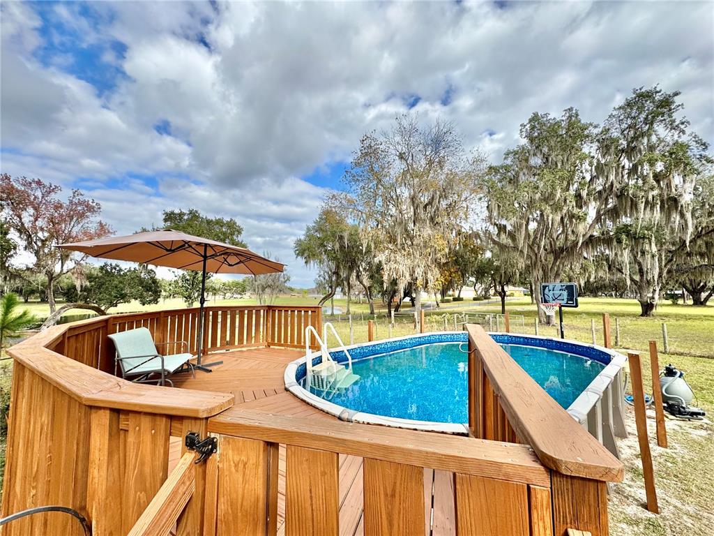 7625 East Misty Lane Inverness, FL 34450 - Photo 8 of 58 a view of a swimming pool with a patio