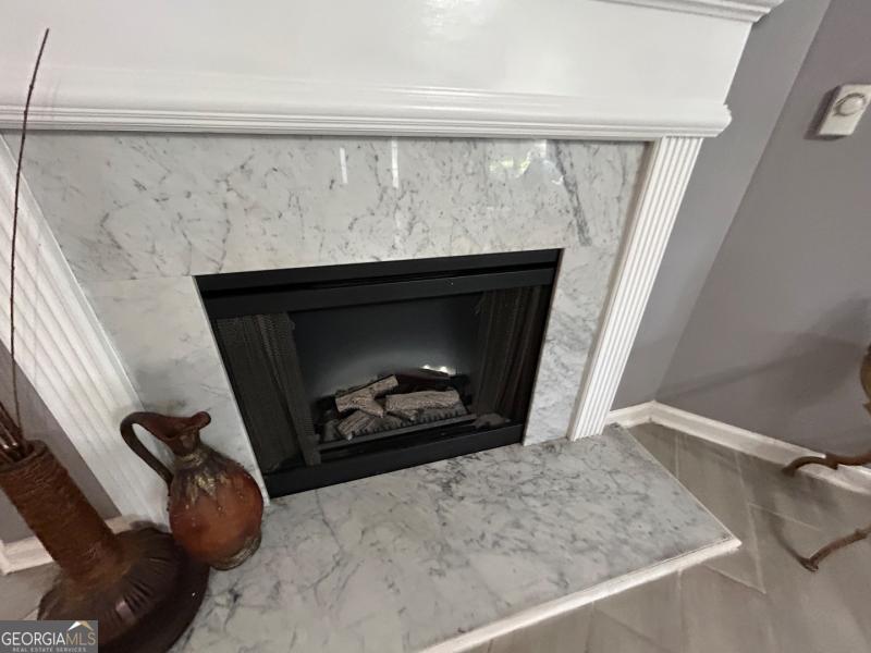 5099 Leeshire Trace Tucker, GA 30084 - Photo 11 of 26 a living room with a fireplace