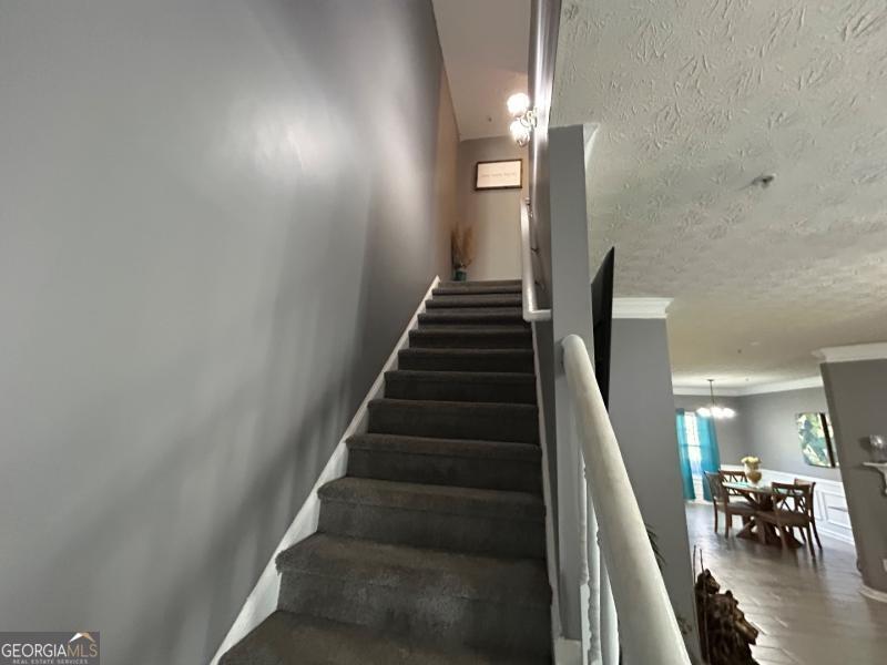 5099 Leeshire Trace Tucker, GA 30084 - Photo 14 of 26 a view of entryway and hall with wooden floor