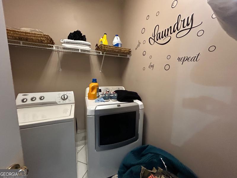 5099 Leeshire Trace Tucker, GA 30084 - Photo 25 of 26 a utility room with dryer and washer