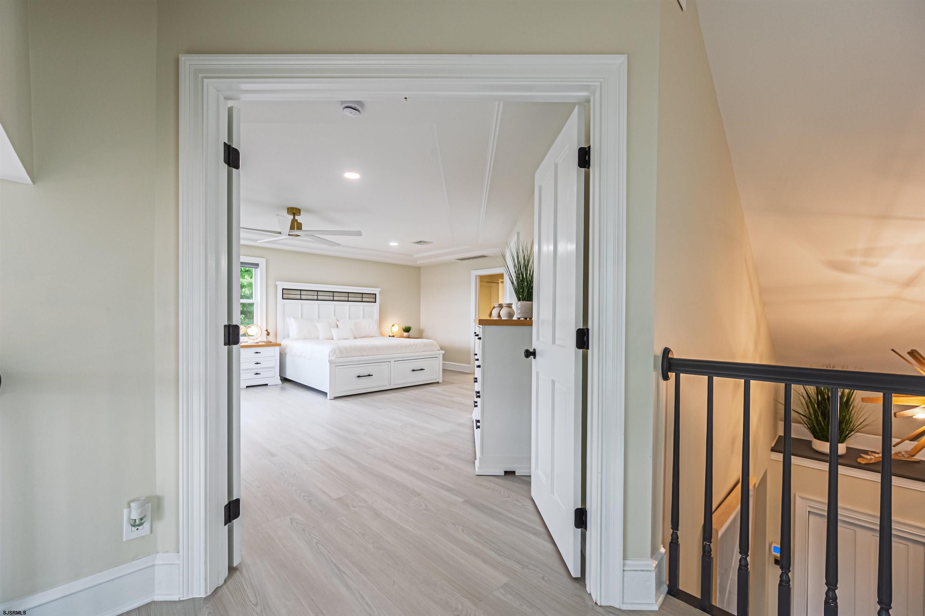 1303 West Riverside Drive Mays Landing, NJ 08330 - Photo 29 of 50 a view of a hallway with a livingroom and wooden floor