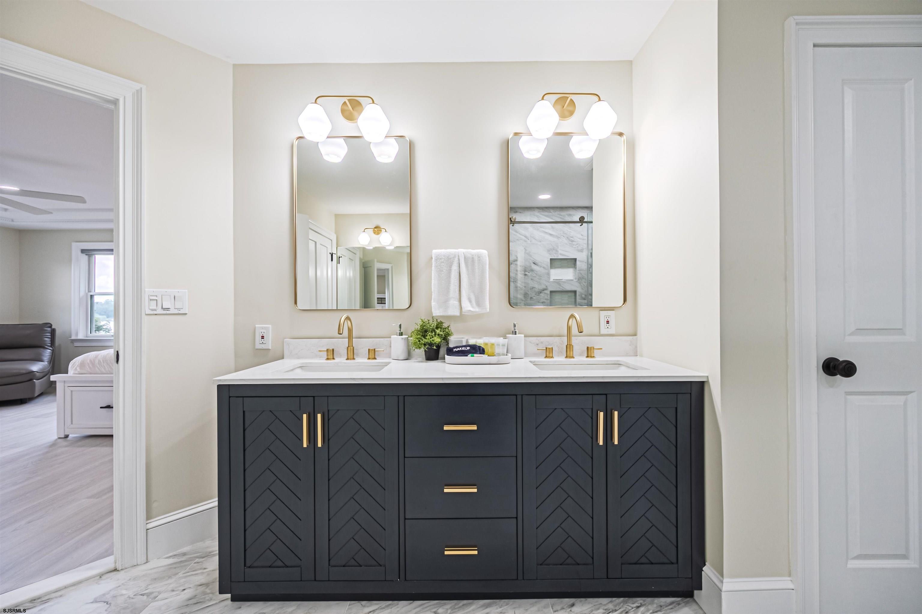 1303 West Riverside Drive Mays Landing, NJ 08330 - Photo 34 of 50 a bathroom with a sink vanity and mirror