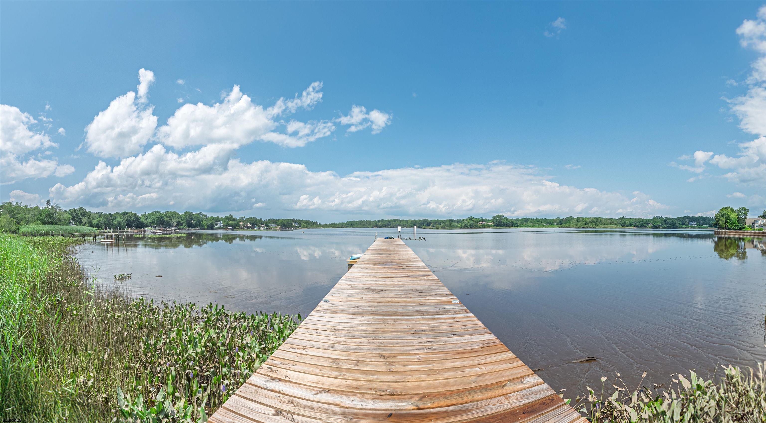 1303 West Riverside Drive Mays Landing, NJ 08330 - Photo 36 of 50 a view of a lake with a large mountain