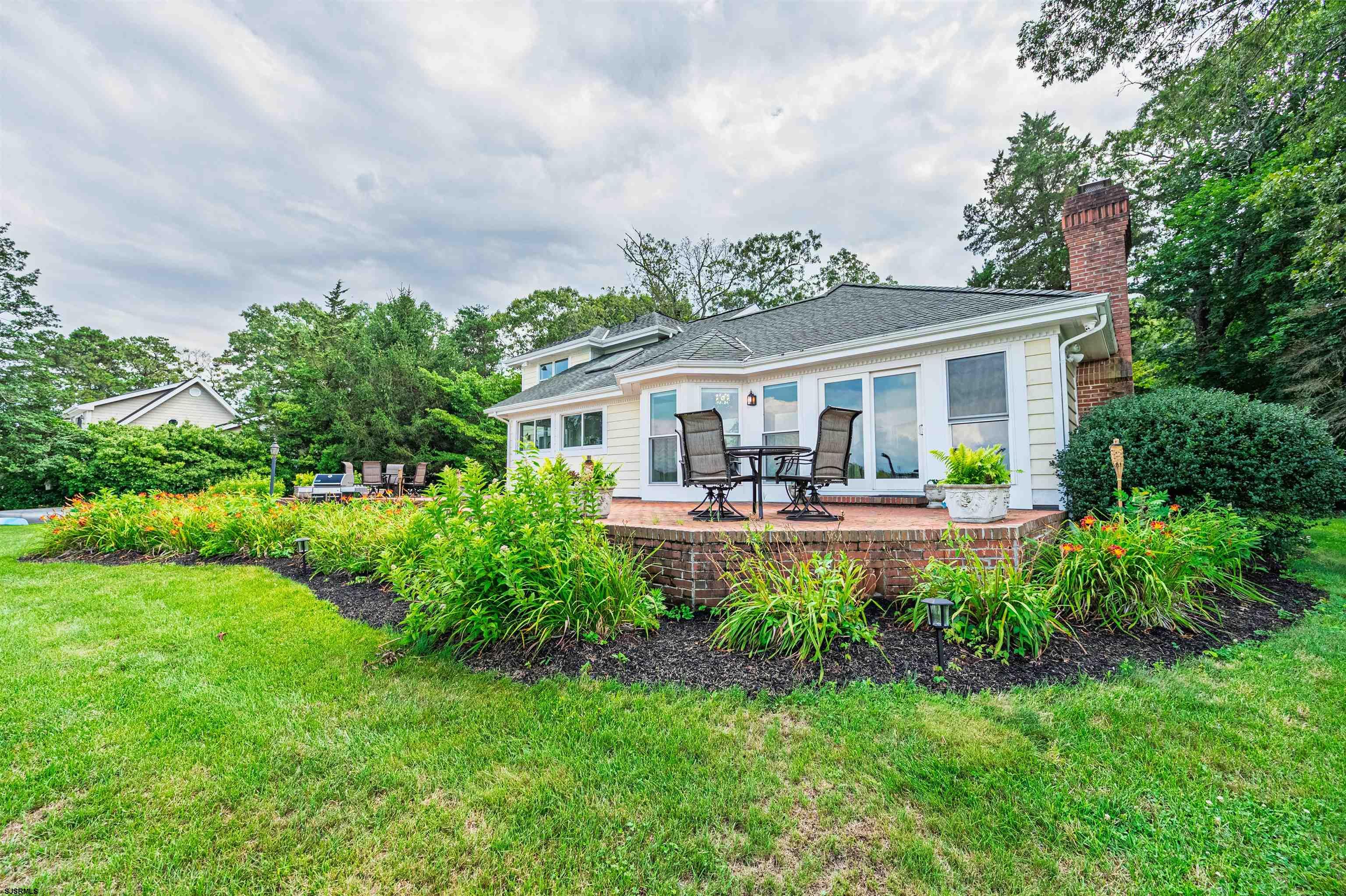 1303 West Riverside Drive Mays Landing, NJ 08330 - Photo 39 of 50 a front view of a house with yard and green space