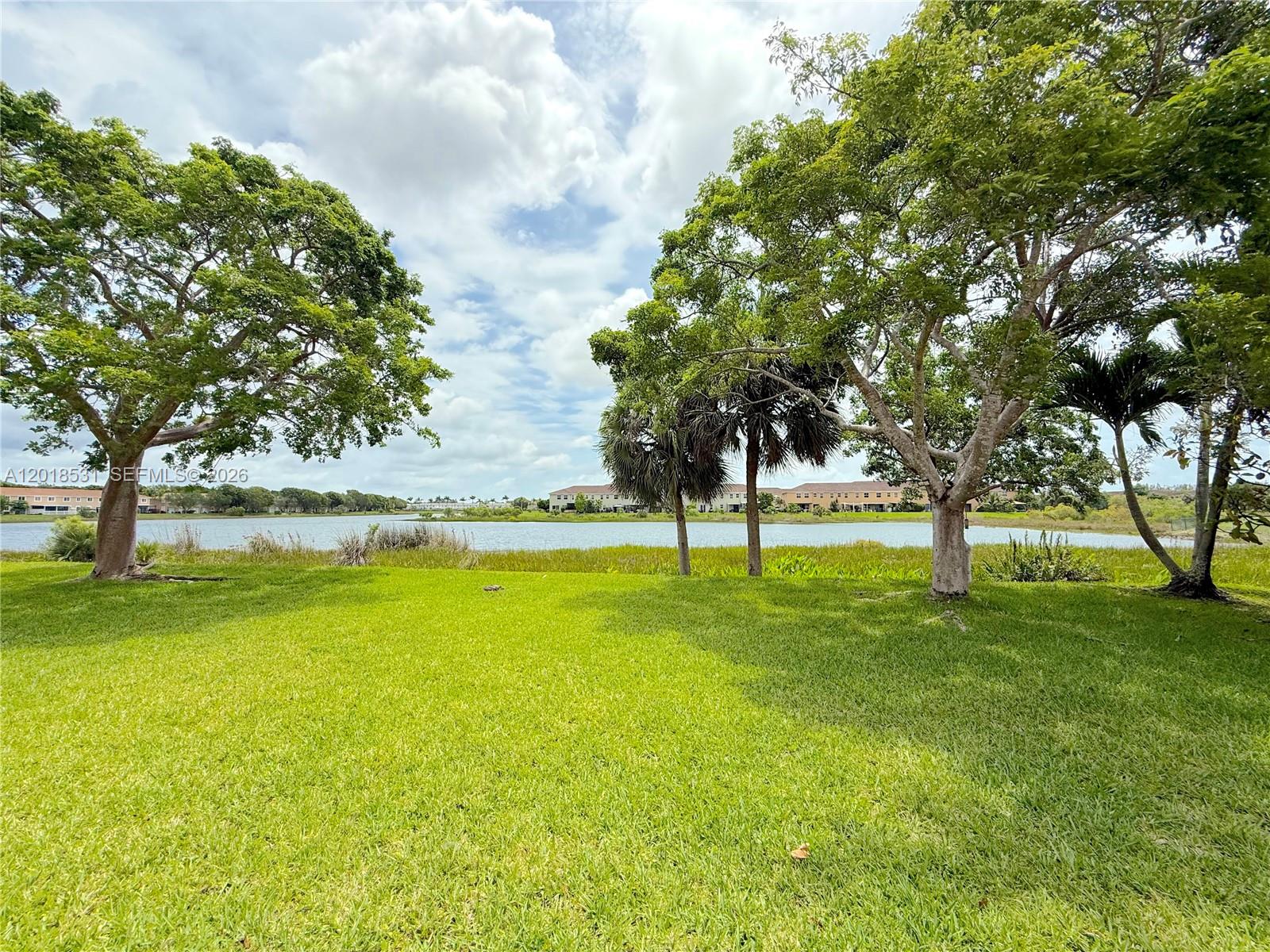 1575 Southeast 20th Road Homestead, FL 33035 - Photo 17 of 19 a view of swimming pool with an outdoor space and seating area
