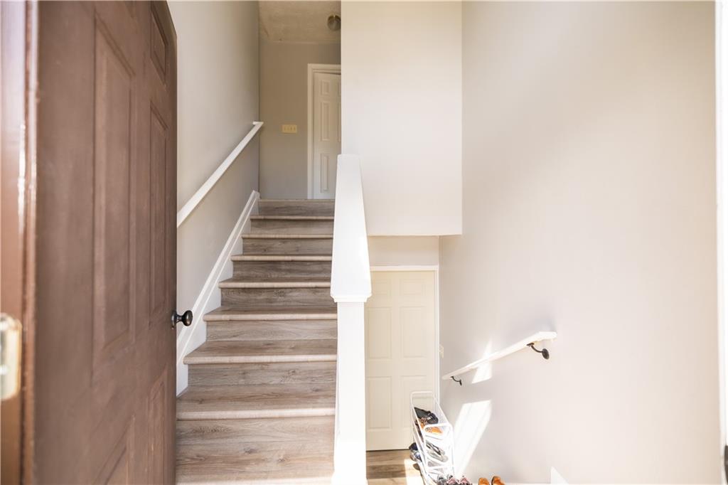 599 Rivulett Court Lawrenceville, GA 30043 - Photo 2 of 31 a view of staircase with white walls