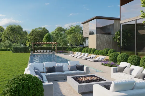 a view of a patio with couches table and chairs with garden view