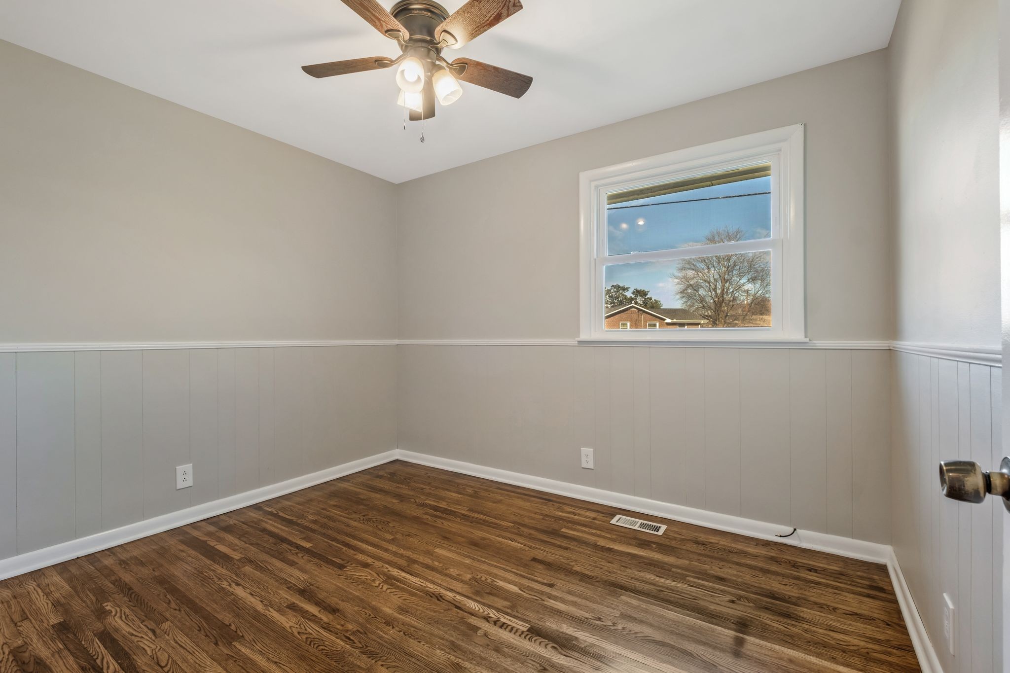 310 Santa Rosa Drive Old Hickory, TN 37138 - Photo 18 of 29 a view of an empty room with wooden floor and a fan