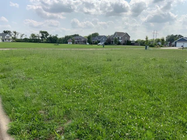 a view of a golf course with green space