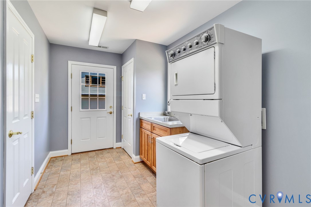 618 Main Street Reedville, VA 22539 - Photo 30 of 54 Dedicated laundry area featuring a stacked washer