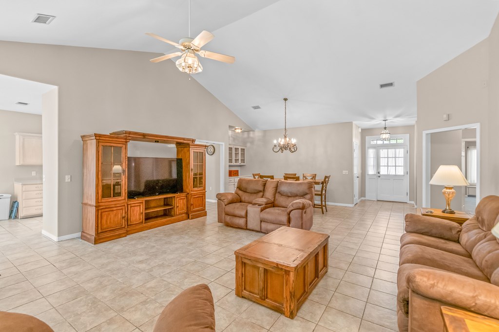 225 Los Cedros Loop Kerrville, TX 78028 - Photo 7 of 27 a living room with furniture and a flat screen tv
