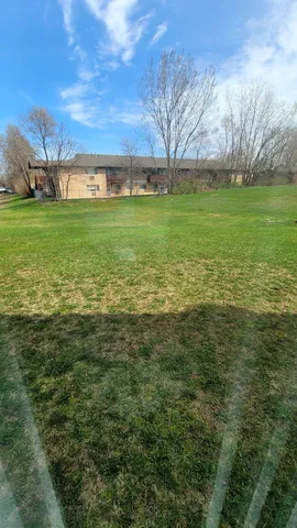 a view of a field with an empty room