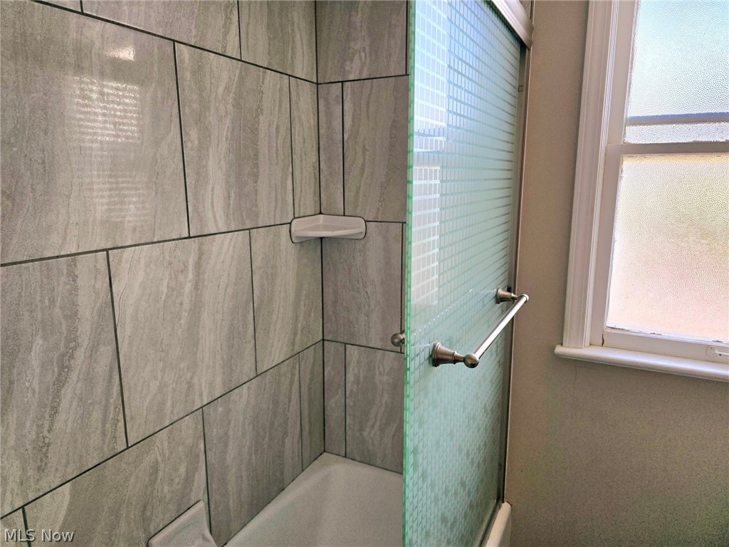 4111 Redfern Road Parma, OH 44134 - Photo 26 of 40 Second floor bathroom with neutral grey tile tub surround