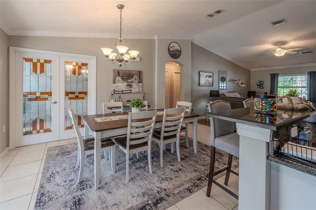 15143 Southwest 14th Avenue Road Ocala, FL 34473 - Photo 9 of 53 a view of a dining room with furniture