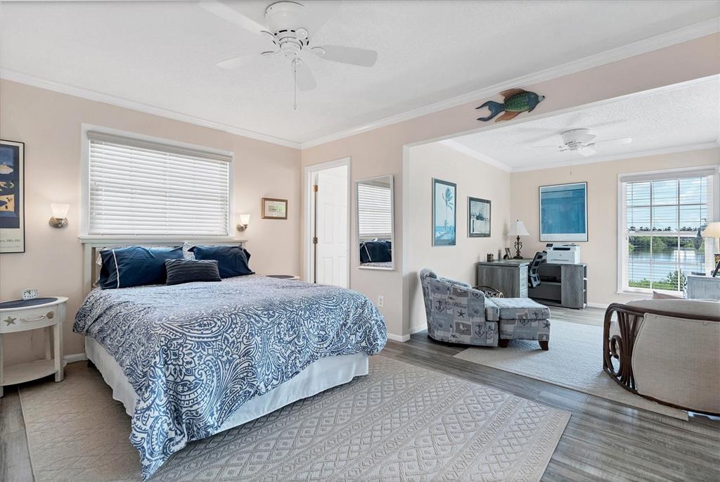4010 40th Street West Boca Grande, FL 33921 - Photo 20 of 48 a bedroom with a large bed and furniture