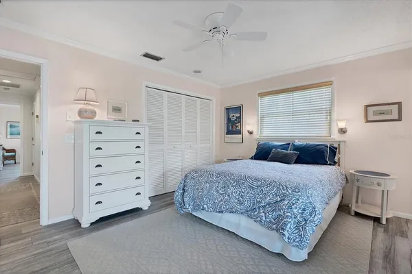 a bedroom with a bed and dresser