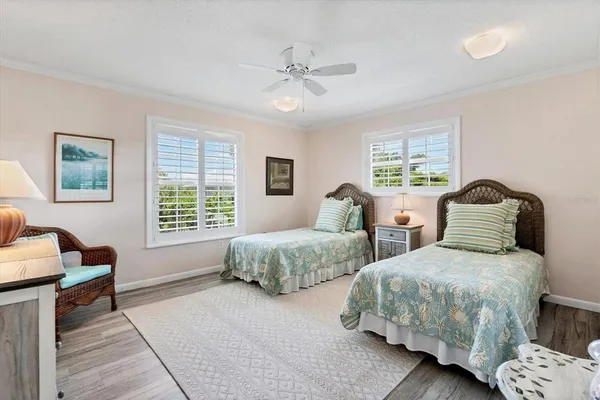 a bedroom with two beds and a couch