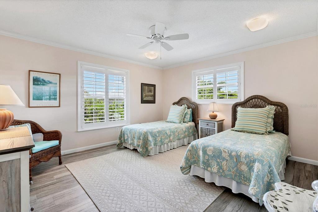4010 40th Street West Boca Grande, FL 33921 - Photo 24 of 48 a bedroom with two beds and a couch
