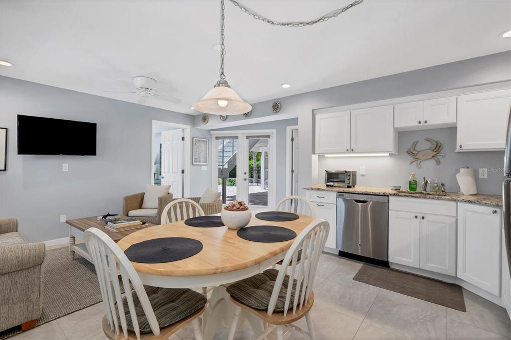 4010 40th Street West Boca Grande, FL 33921 - Photo 33 of 48 a view of a dining room with furniture and a chandelier