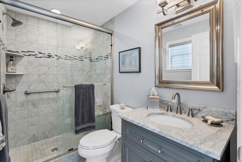 4010 40th Street West Boca Grande, FL 33921 - Photo 37 of 48 a bathroom with a granite countertop sink toilet and shower