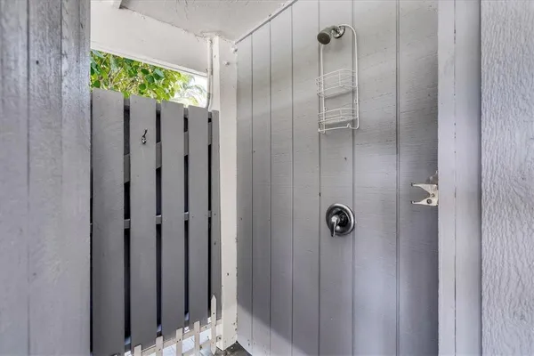 a bathroom with a shower and a shower