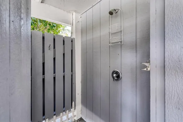 a bathroom with a shower and a shower