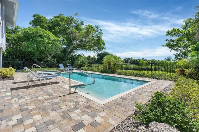 a view of a swimming pool with a yard