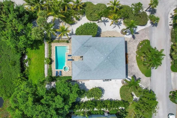 an aerial view of a house with a garden