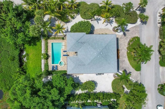 an aerial view of a house with a garden