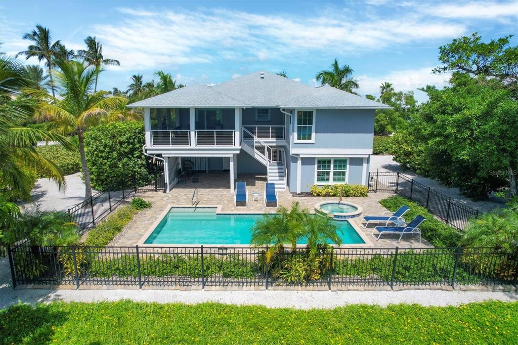 4010 40th Street West Boca Grande, FL 33921 - Photo 9 of 48 a front view of house with yard and green space