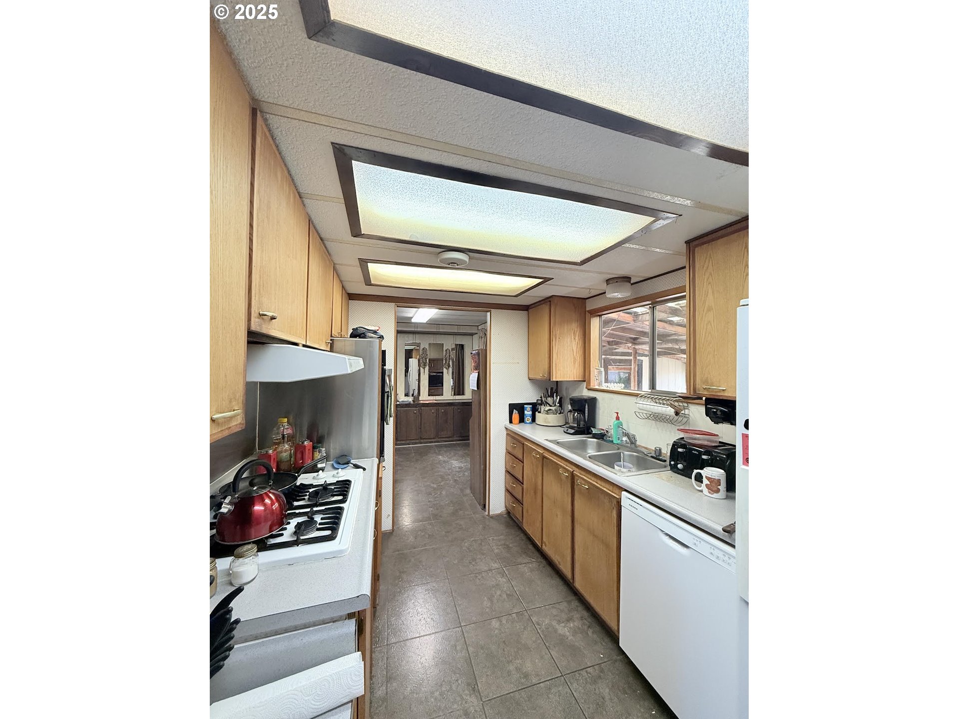 505 North 16th Avenue Elgin, OR 97827 - Photo 12 of 48 a kitchen with stainless steel appliances granite countertop a sink and cabinets