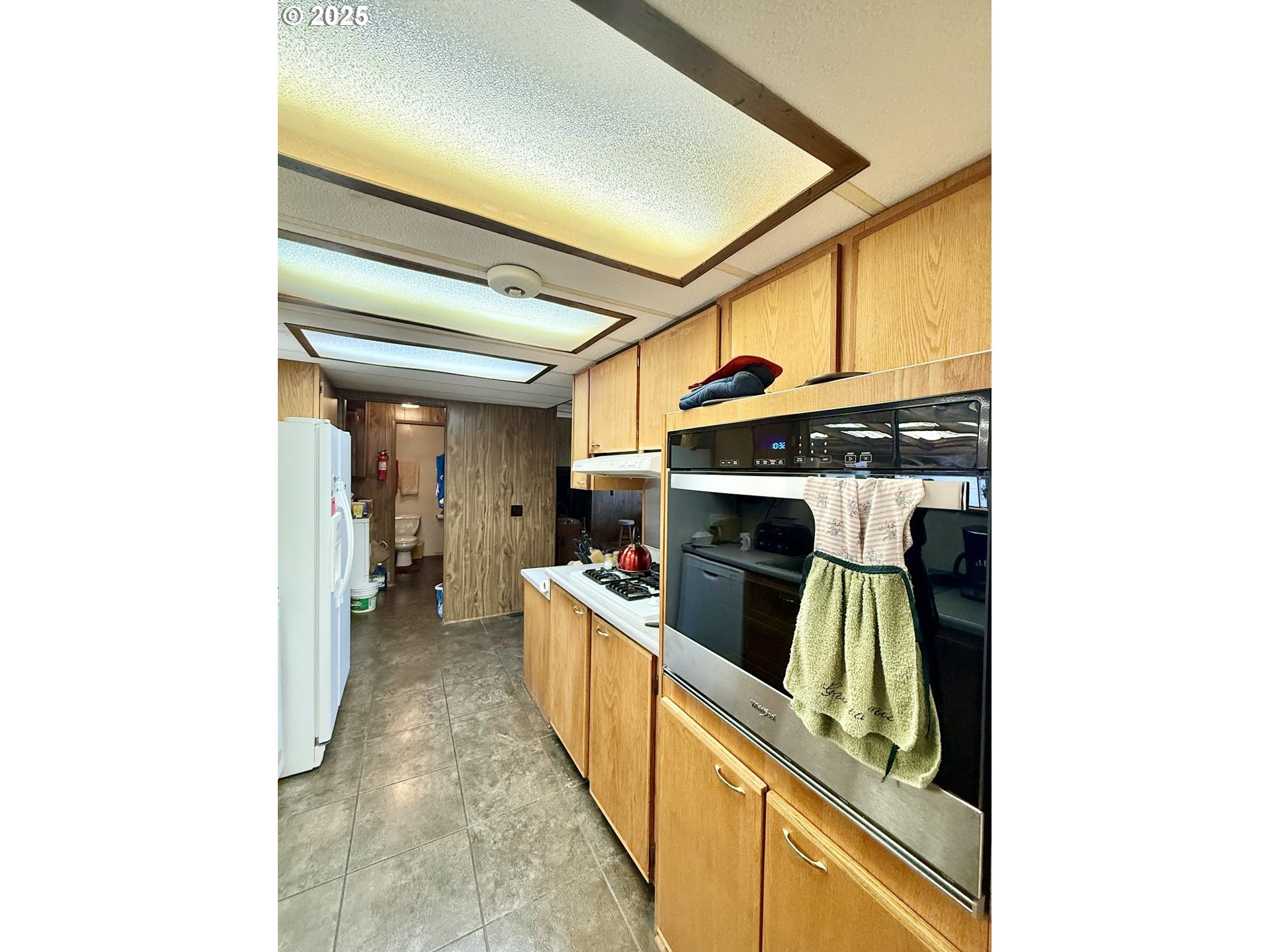 505 North 16th Avenue Elgin, OR 97827 - Photo 14 of 48 a view of a kitchen with furniture and a kitchen