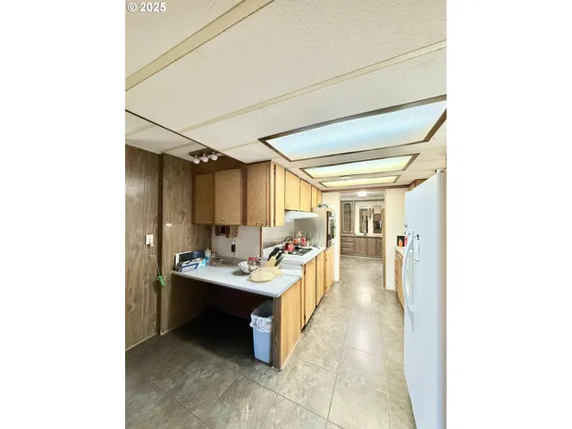 a view of a hallway with seating area