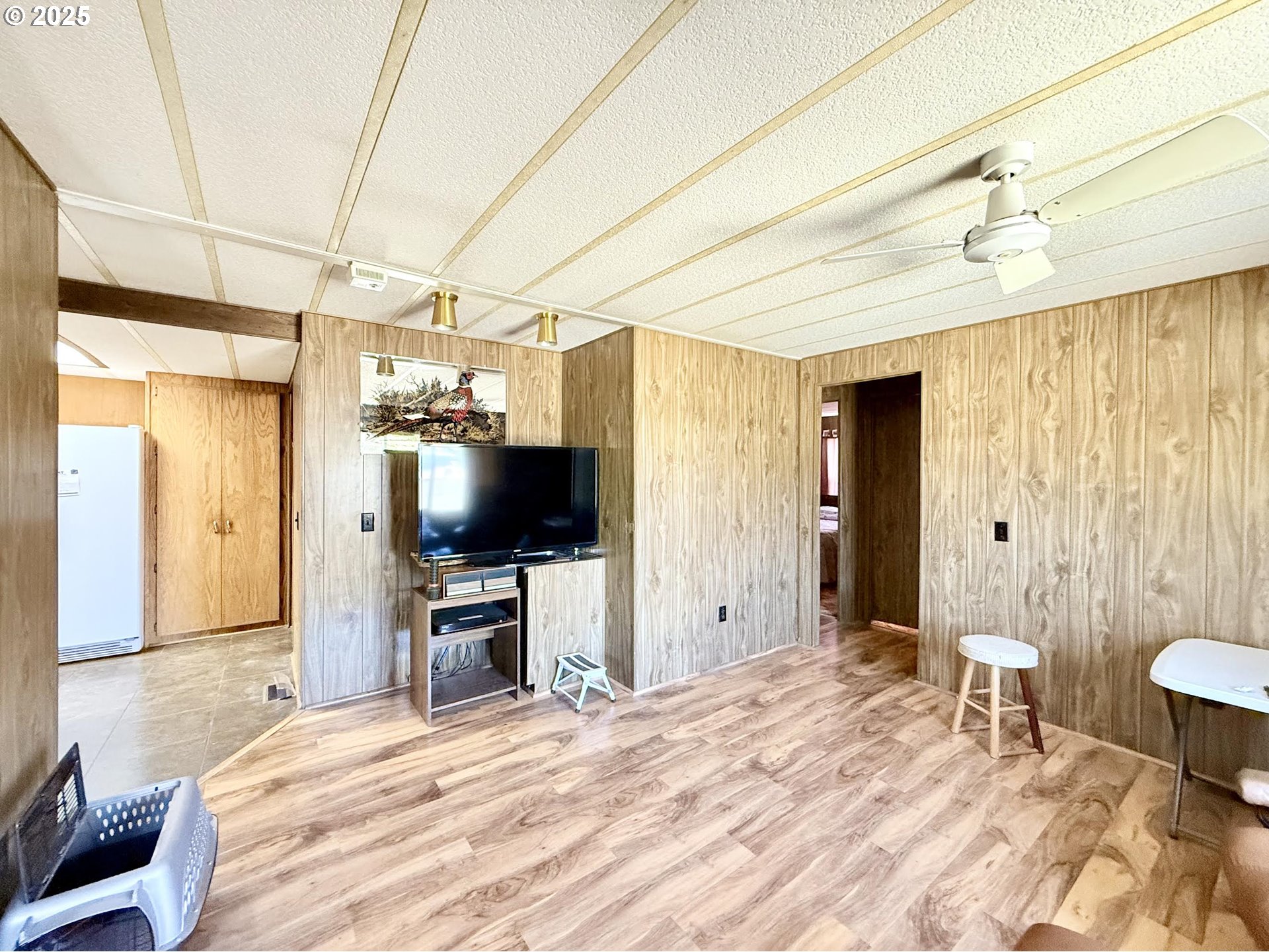 505 North 16th Avenue Elgin, OR 97827 - Photo 21 of 48 a bedroom with a bed and a flat screen tv