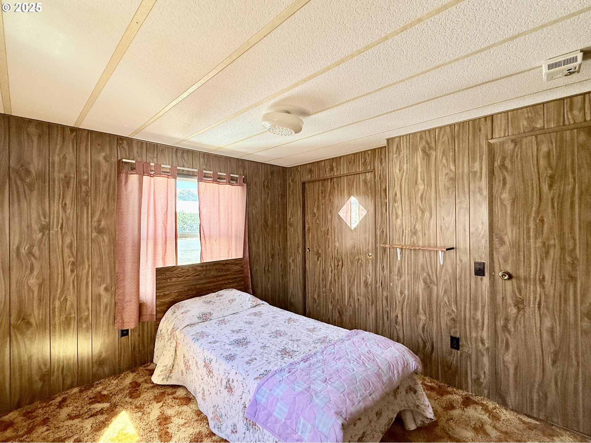 505 North 16th Avenue Elgin, OR 97827 - Photo 29 of 48 a bedroom with a bed and a window